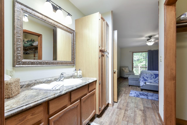 26094 State Highway 39, Shell Knob, MO 65747 - ensuite bathroom with wood finished floors, vanity, and a ceiling fan