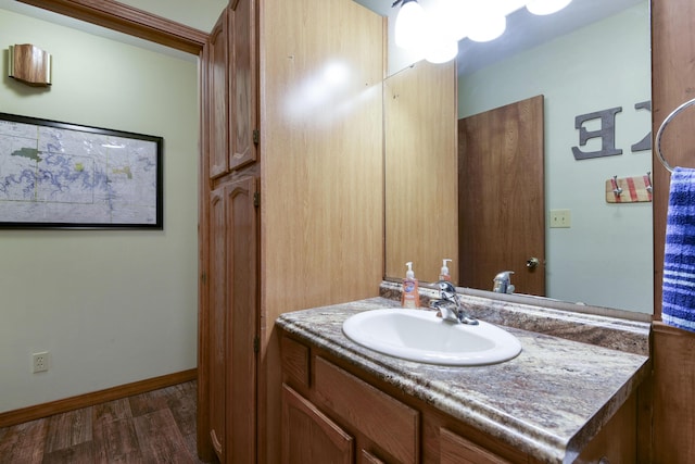 26094 State Highway 39, Shell Knob, MO 65747 - bathroom with vanity, wood finished floors, and baseboards