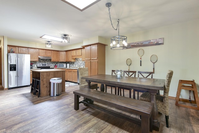 26094 State Highway 39, Shell Knob, MO 65747 - dining room with wood finished floors and a chandelier