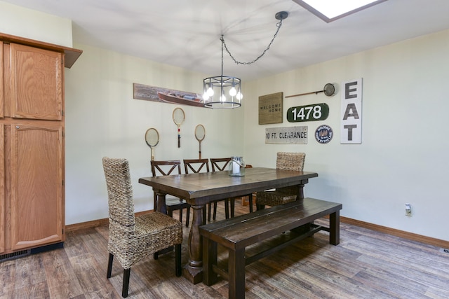 26094 State Highway 39, Shell Knob, MO 65747 - dining area with wood finished floors, baseboards, and a chandelier