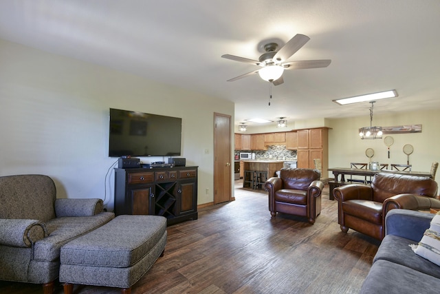26094 State Highway 39, Shell Knob, MO 65747 - living room featuring dark wood finished floors, a ceiling fan, and a chandelier