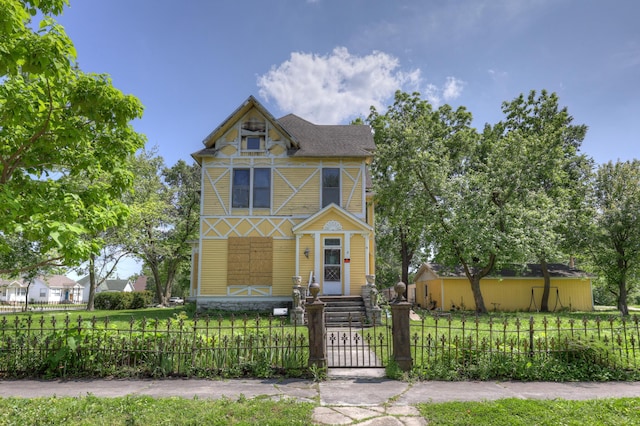 302 S Pennsylvania St, Webb City, MO 64870 - victorian-style house with a fenced front yard and a gate