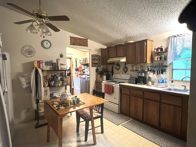 1615 E 562nd Rd, Brighton, MO 65617 - kitchen featuring white electric stove, under cabinet range hood, washer and clothes dryer, a sink, and ceiling fan