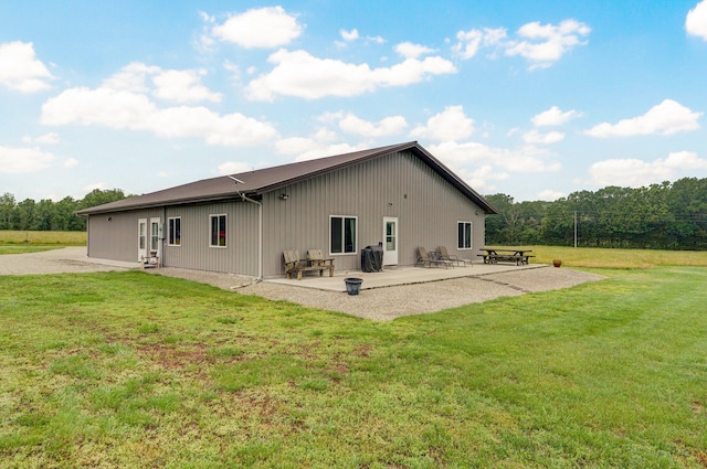 22510 Lawrence Unit 1200, Aurora, MO 65605 - rear view of house with a patio and a lawn