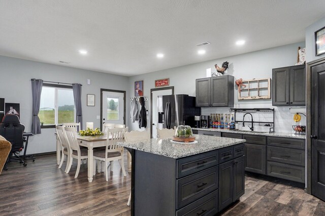 22510 Lawrence Unit 1200, Aurora, MO 65605 - kitchen featuring a sink, refrigerator with ice dispenser, dark wood-style flooring, recessed lighting, and a kitchen island