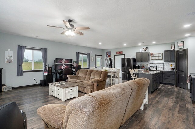 22510 Lawrence Unit 1200, Aurora, MO 65605 - living area featuring ceiling fan, dark wood finished floors, and recessed lighting
