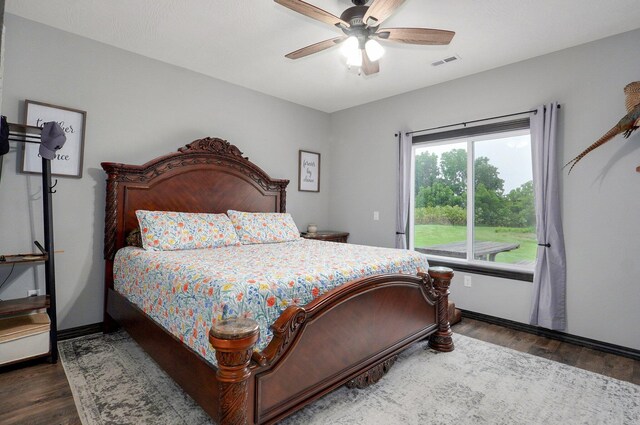 22510 Lawrence Unit 1200, Aurora, MO 65605 - bedroom featuring wood finished floors, a ceiling fan, and baseboards