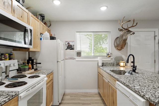 166 Seaman St, Cape Fair, MO 65624 - kitchen featuring white appliances, a sink, light brown cabinetry, light wood-type flooring, and baseboards
