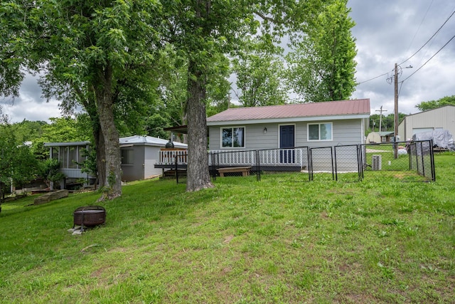 166 Seaman St, Cape Fair, MO 65624 - view of front of home featuring metal roof, a deck, and an outdoor fire pit