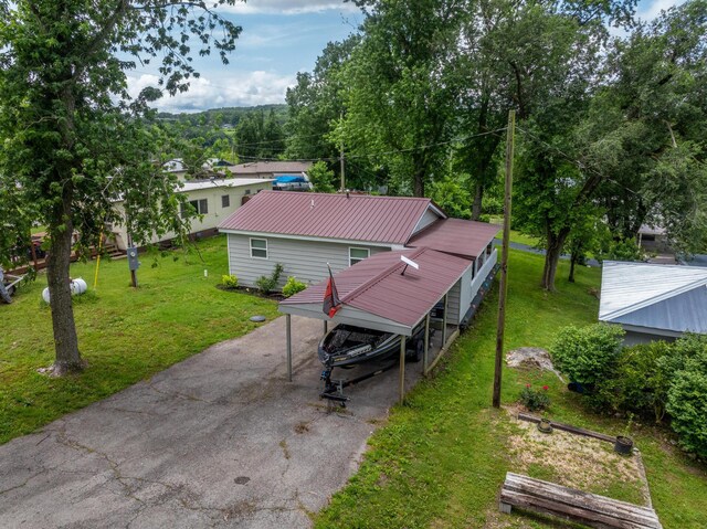 166 Seaman St, Cape Fair, MO 65624 - rear view of house featuring metal roof and a yard