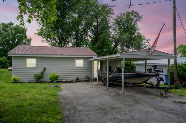 166 Seaman St, Cape Fair, MO 65624 - view of front of home with asphalt driveway, metal roof, and a carport