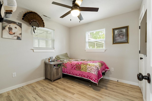 166 Seaman St, Cape Fair, MO 65624 - bedroom with light wood finished floors, baseboards, and a ceiling fan
