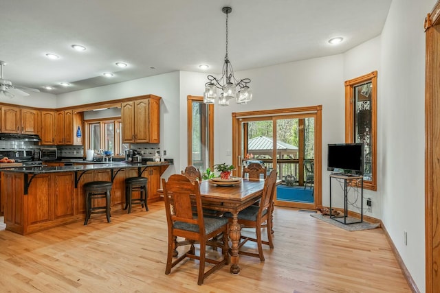 1915 S Farm Rd Unit 219, Springfield, MO 65809 - dining room featuring light wood-type flooring, a chandelier, recessed lighting, baseboards, and a ceiling fan