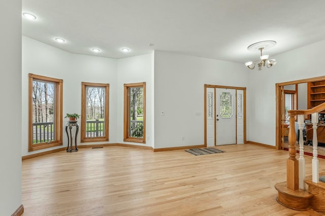 1915 S Farm Rd Unit 219, Springfield, MO 65809 - entryway with light wood-type flooring, healthy amount of natural light, and stairs
