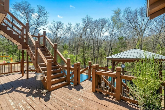 1915 S Farm Rd Unit 219, Springfield, MO 65809 - deck with stairs, a forest view, and a gazebo