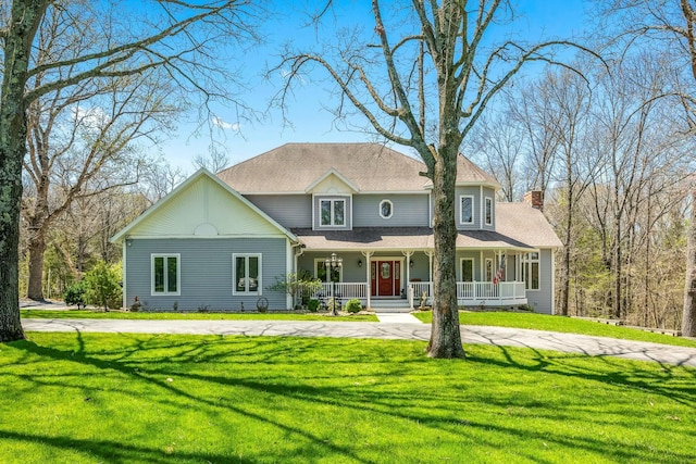 1915 S Farm Rd Unit 219, Springfield, MO 65809 - victorian home with covered porch, a front lawn, and a chimney