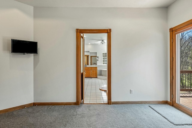 1915 S Farm Rd Unit 219, Springfield, MO 65809 - carpeted spare room featuring baseboards and ceiling fan