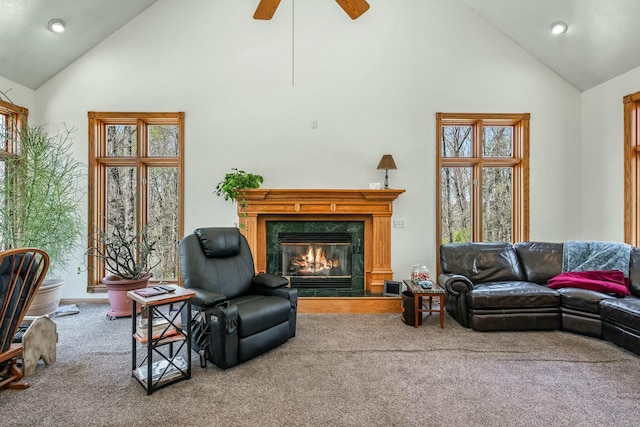 1915 S Farm Rd Unit 219, Springfield, MO 65809 - carpeted living area with high vaulted ceiling, a high end fireplace, recessed lighting, plenty of natural light, and a ceiling fan