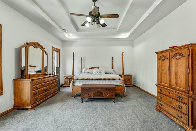 1915 S Farm Rd Unit 219, Springfield, MO 65809 - bedroom with carpet floors, a raised ceiling, baseboards, and ceiling fan