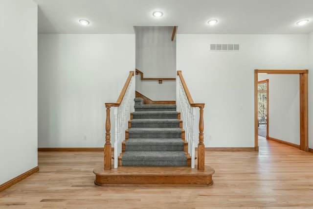 1915 S Farm Rd Unit 219, Springfield, MO 65809 - staircase with wood finished floors and baseboards