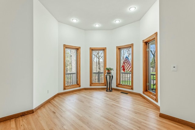 1915 S Farm Rd Unit 219, Springfield, MO 65809 - empty room featuring light wood-style flooring and baseboards