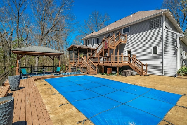 1915 S Farm Rd Unit 219, Springfield, MO 65809 - back of property featuring stairway, a gazebo, a deck, and a patio area