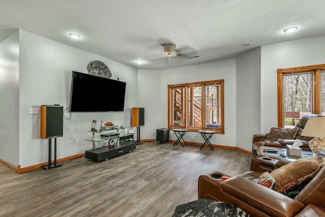 1915 S Farm Rd Unit 219, Springfield, MO 65809 - living area featuring a ceiling fan, baseboards, wood finished floors, a textured ceiling, and recessed lighting