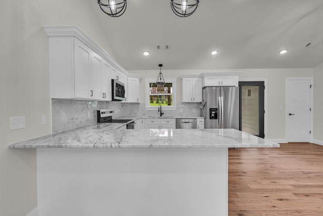 3002 Ginger Dr, West Plains, MO 65775 - kitchen with stainless steel appliances, a sink, white cabinetry, tasteful backsplash, and light wood-style flooring