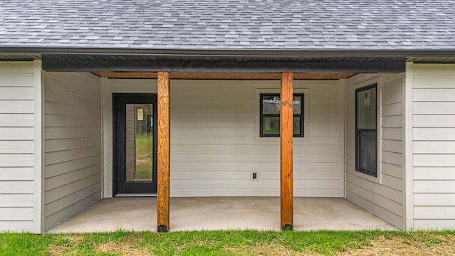 3002 Ginger Dr, West Plains, MO 65775 - doorway to property featuring roof with shingles and a patio