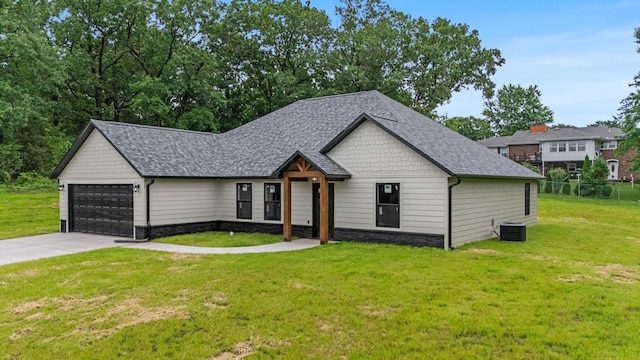3002 Ginger Dr, West Plains, MO 65775 - view of front facade with stone siding, central AC, a shingled roof, and concrete driveway