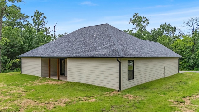 3002 Ginger Dr, West Plains, MO 65775 - rear view of property featuring a shingled roof and a yard