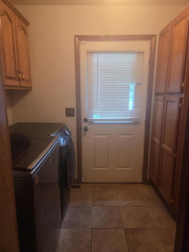 108 Prince St, Buffalo, MO 65622 - washroom with washer and dryer, cabinet space, and light tile patterned floors