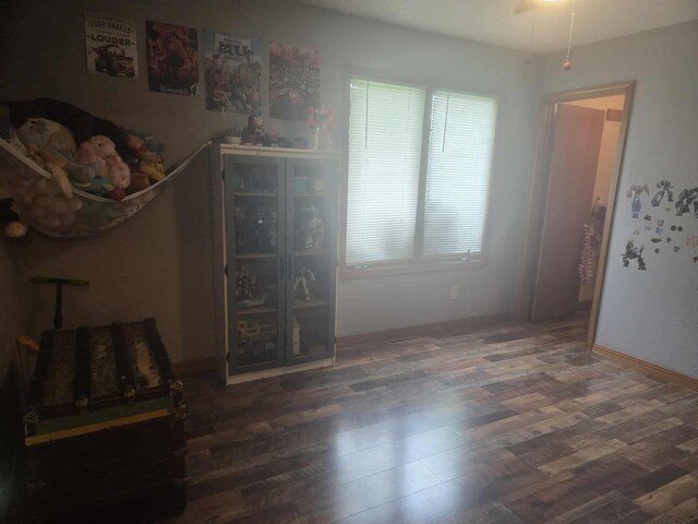 108 Prince St, Buffalo, MO 65622 - unfurnished bedroom featuring wood finished floors and baseboards