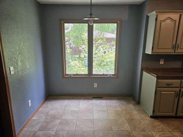 108 Prince St, Buffalo, MO 65622 - unfurnished dining area featuring baseboards and a textured wall