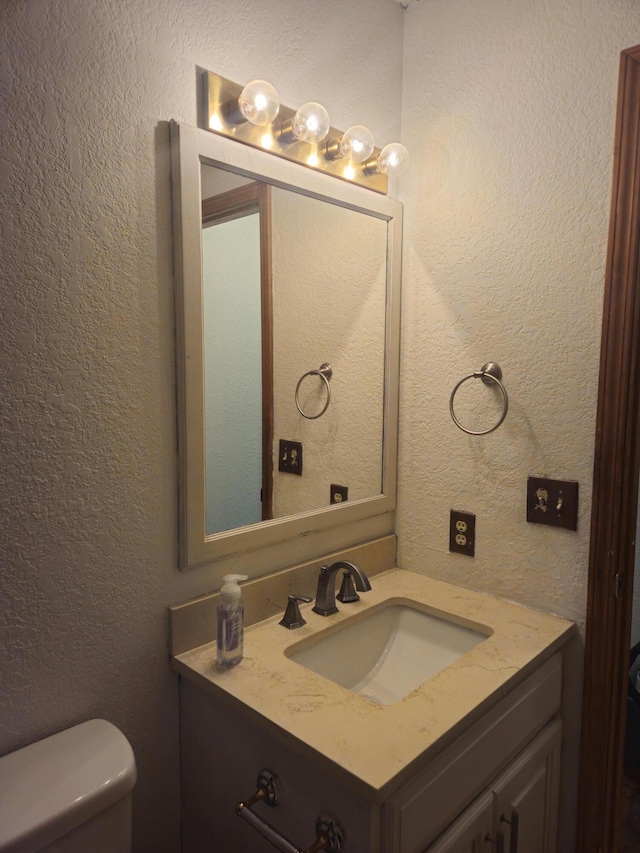 108 Prince St, Buffalo, MO 65622 - half bath featuring a textured wall, vanity, and toilet