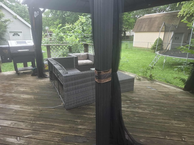 108 Prince St, Buffalo, MO 65622 - wooden terrace with a trampoline, a yard, and a grill