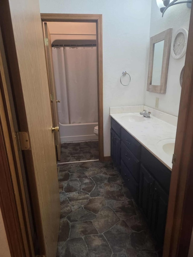 108 Prince St, Buffalo, MO 65622 - full bath with double vanity, stone finish flooring, toilet, and shower / bath combo