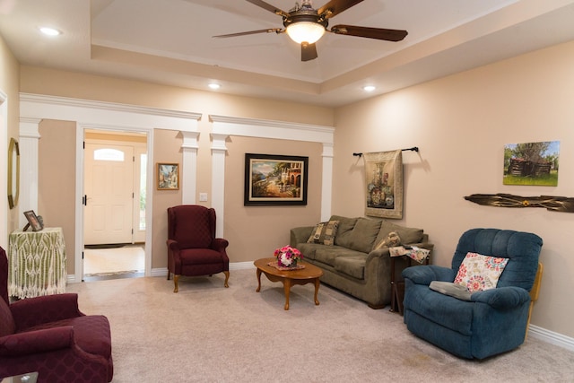 1762 Hickory Ridge Cir, Nixa, MO 65714 - living room with decorative columns, light colored carpet, a raised ceiling, a ceiling fan, and recessed lighting