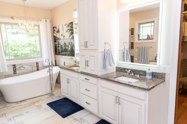 1762 Hickory Ridge Cir, Nixa, MO 65714 - full bathroom with double vanity, a chandelier, and a soaking tub