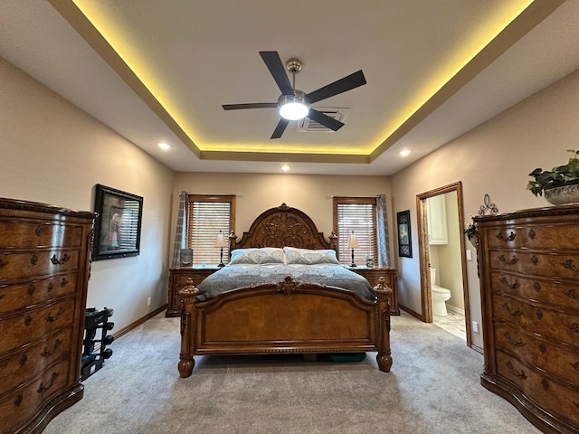 1762 Hickory Ridge Cir, Nixa, MO 65714 - bedroom with a raised ceiling, light colored carpet, baseboards, connected bathroom, and recessed lighting