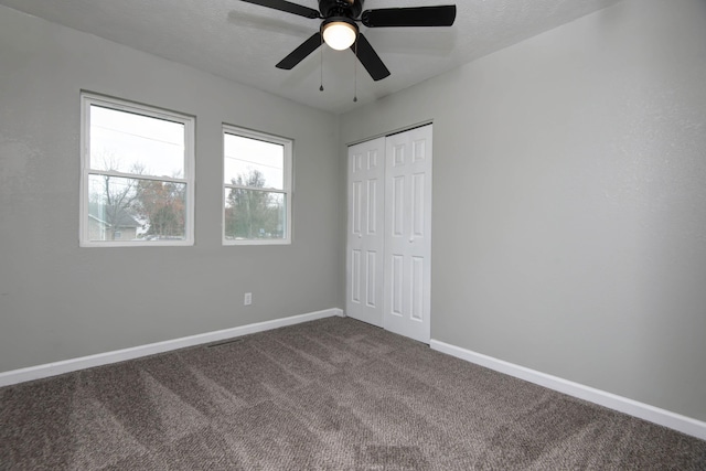 304 Rice St, Nixa, MO 65714 - unfurnished bedroom featuring dark carpet, baseboards, a closet, and ceiling fan