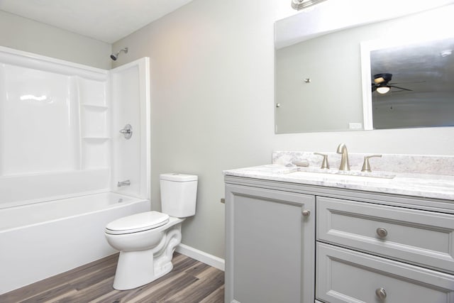 304 Rice St, Nixa, MO 65714 - bathroom featuring vanity, wood finished floors, toilet, tub / shower combination, and ceiling fan
