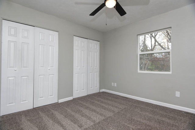 304 Rice St, Nixa, MO 65714 - unfurnished bedroom featuring multiple closets, carpet floors, baseboards, and ceiling fan