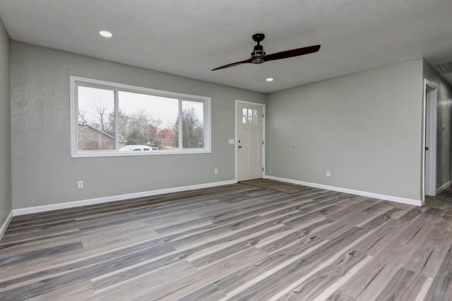 304 Rice St, Nixa, MO 65714 - foyer entrance featuring wood finished floors, healthy amount of natural light, a ceiling fan, baseboards, and recessed lighting