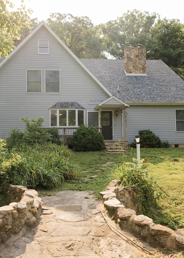 19429 E State Highway 14, Ava, MO 65608 - view of front facade with a chimney, a front lawn, and roof with shingles
