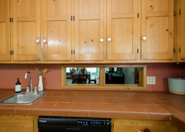 19429 E State Highway 14, Ava, MO 65608 - kitchen featuring a sink, dishwasher, tile countertops, and backsplash