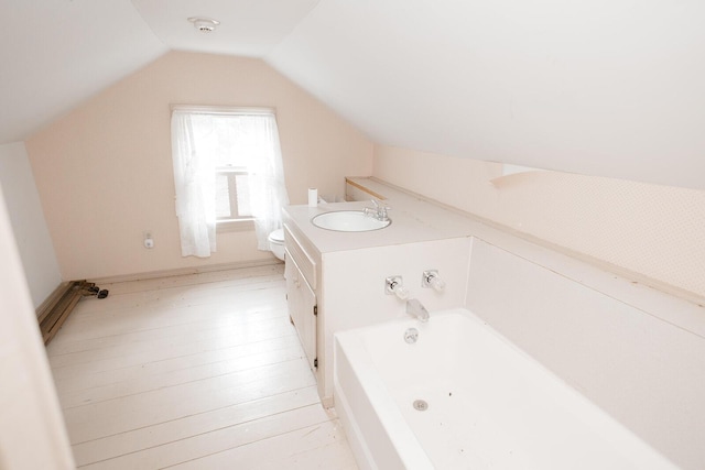 19429 E State Highway 14, Ava, MO 65608 - bathroom featuring toilet, lofted ceiling, a bath, wood finished floors, and vanity