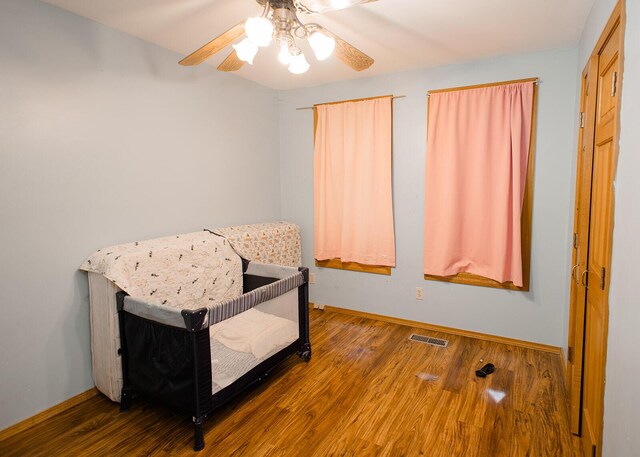19429 E State Highway 14, Ava, MO 65608 - bedroom featuring wood finished floors, baseboards, and ceiling fan