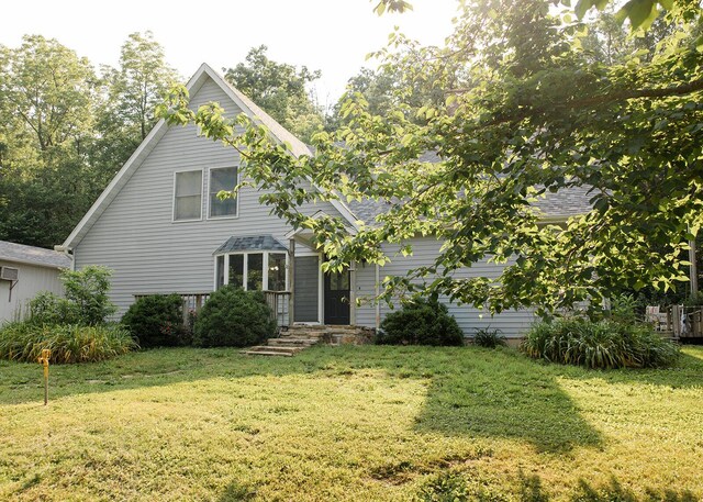 19429 E State Highway 14, Ava, MO 65608 - view of front facade with a front lawn, a shingled roof, and a wall mounted air conditioner