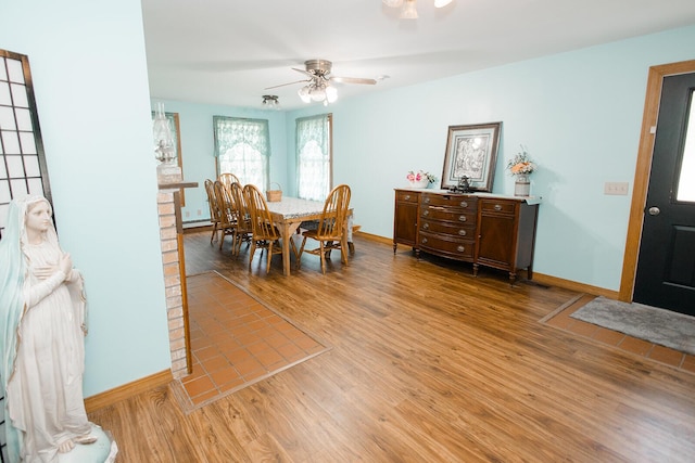 19429 E State Highway 14, Ava, MO 65608 - dining room featuring light wood finished floors, baseboards, and a ceiling fan